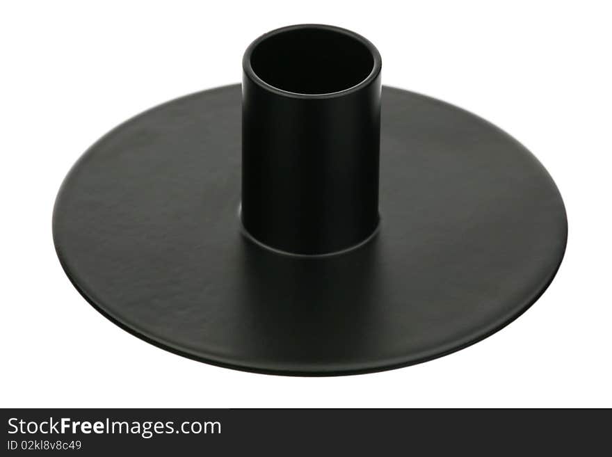 The black metal candlestick is isolated on a white background. The black metal candlestick is isolated on a white background