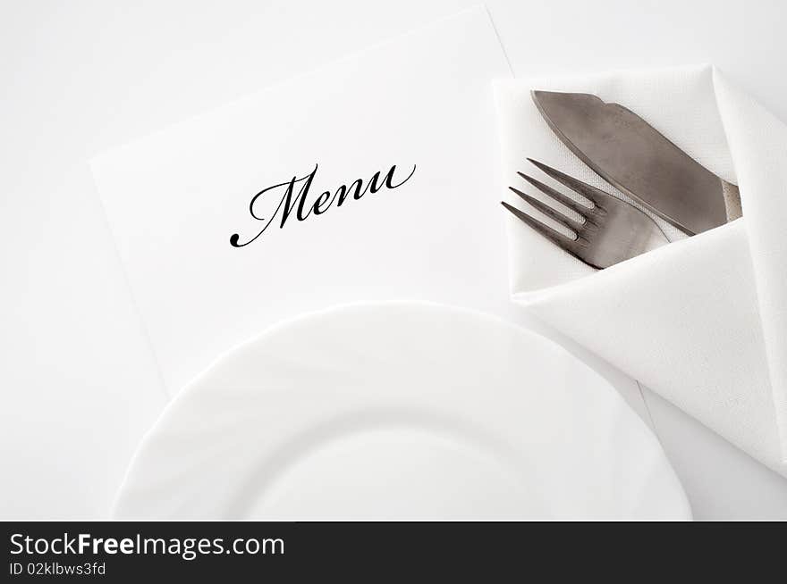 An image of a plate, knife and fork. An image of a plate, knife and fork