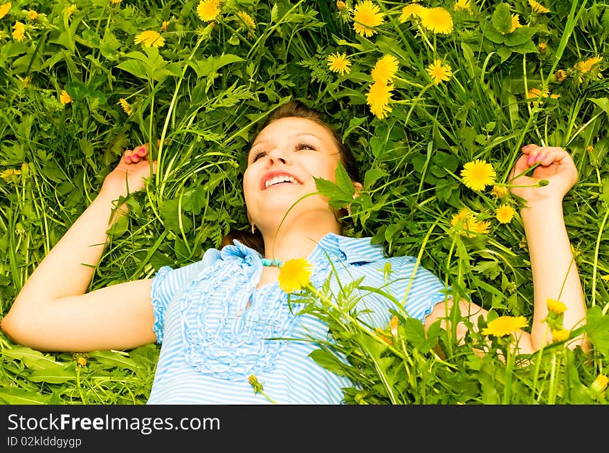 Portrait of young smiling woman on meadow. Portrait of young smiling woman on meadow