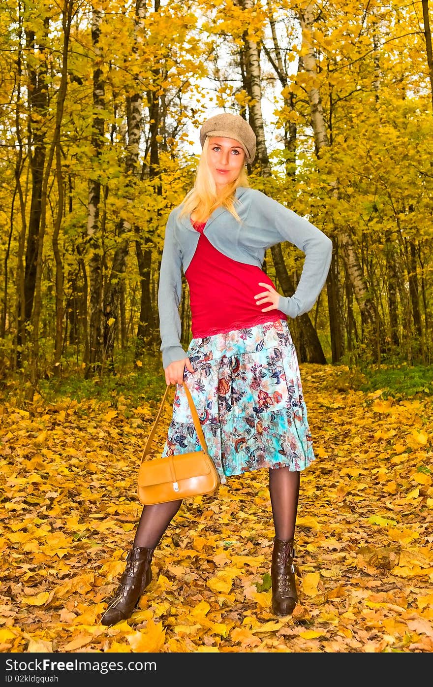 Pretty girl in autumn forest