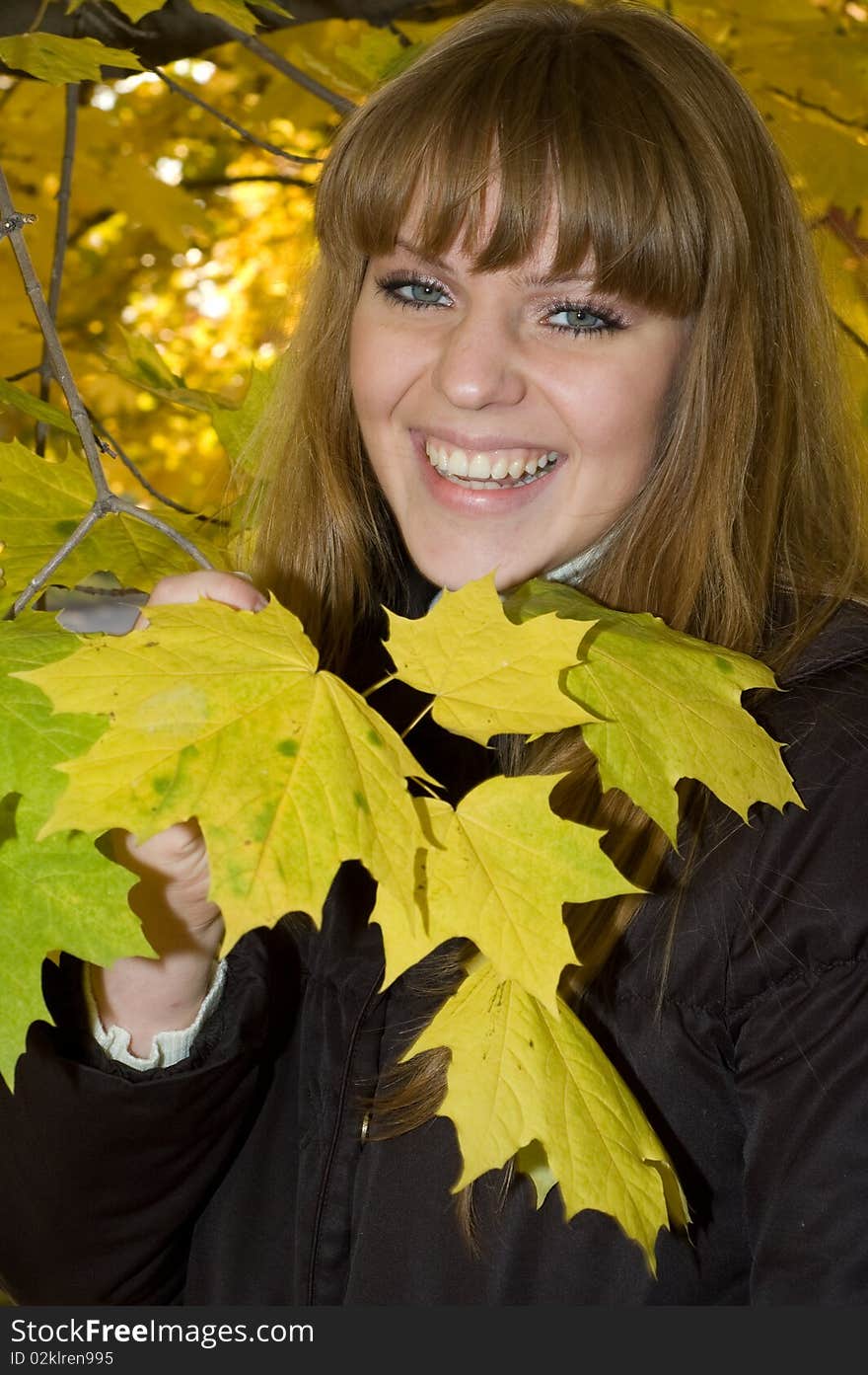 Young girl in autumn park