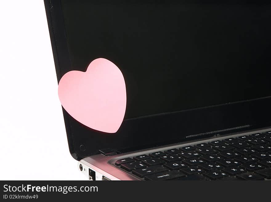 Black laptop screen with pink sticker. Black laptop screen with pink sticker