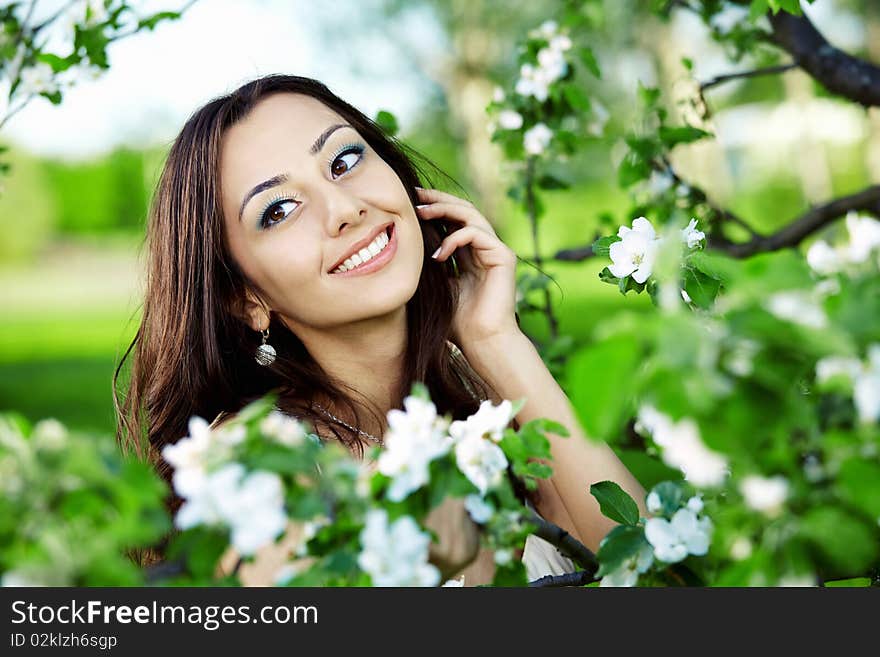 The nice girl in greens of trees