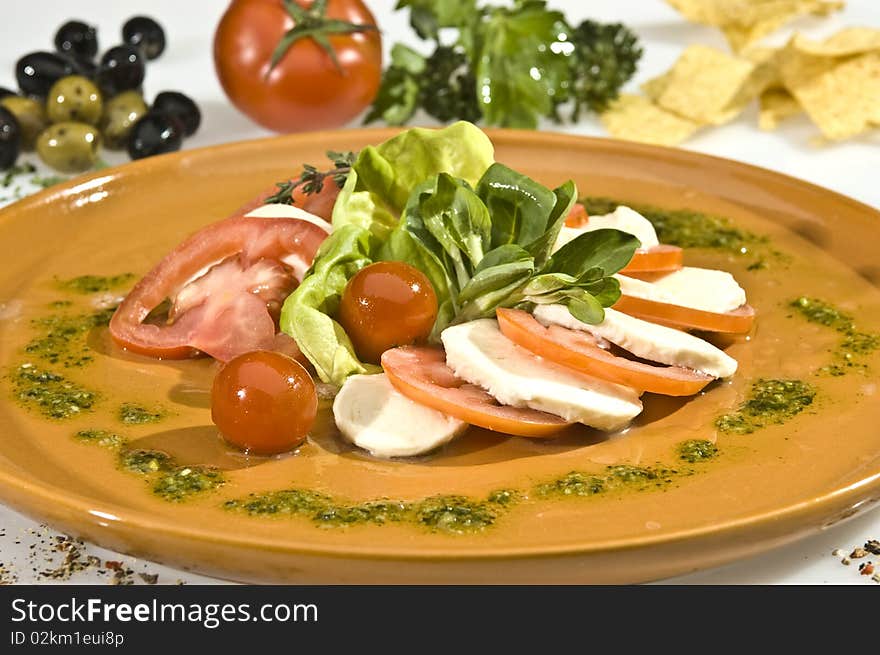 Mozzarella dish with tomato, lettuce and spinach. Mozzarella dish with tomato, lettuce and spinach