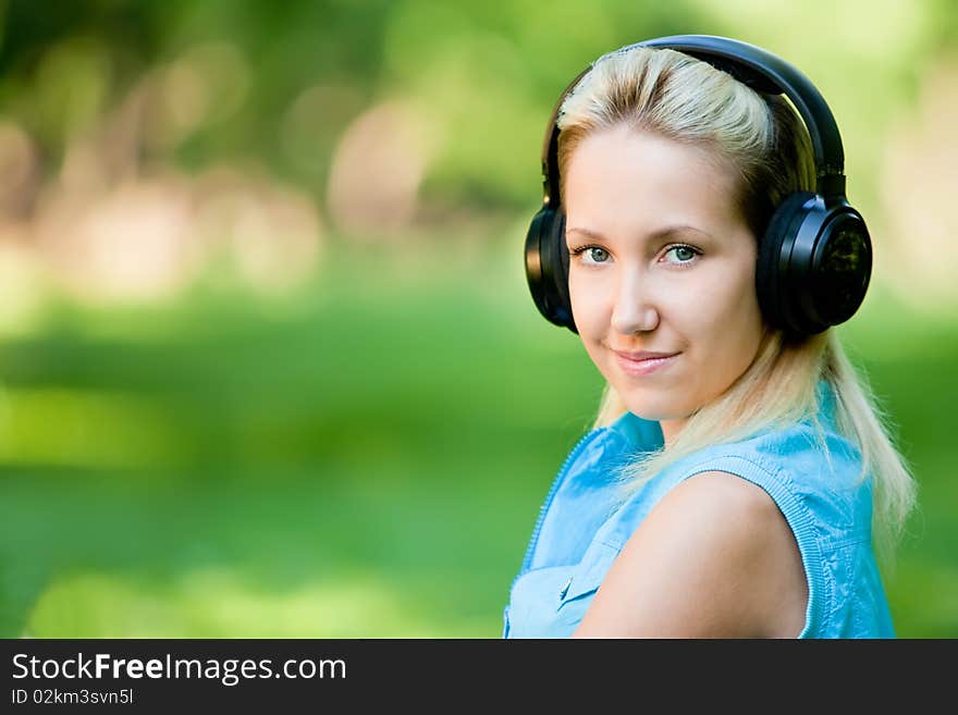 Girl listening music on headphones