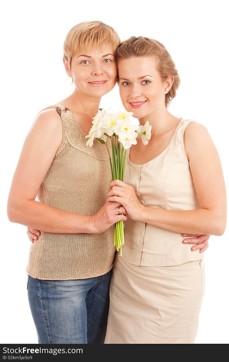 Smiling mother and daughter  with flowers isolated on white