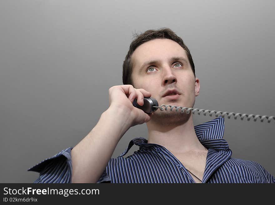 Young man talking by phone