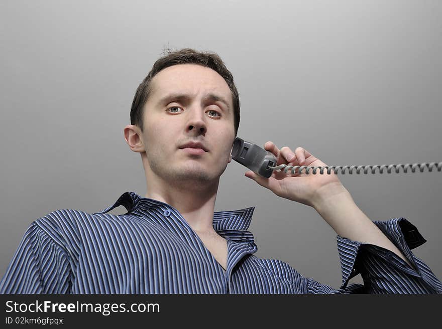 Young man talking by phone