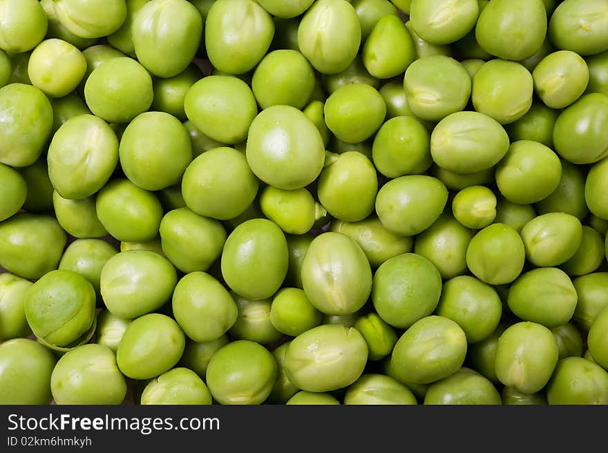 Background of fresh green peas. Close up shot.