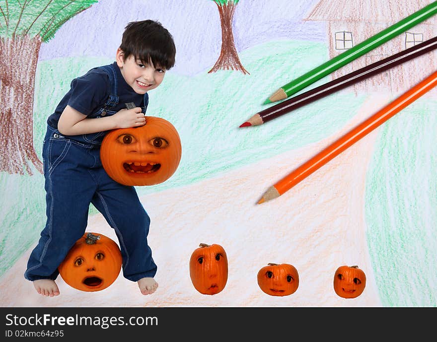 Six year old boy in an imaginary pumpkin patch.