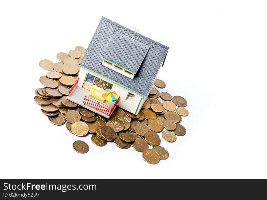 House on pile of coins. House on pile of coins