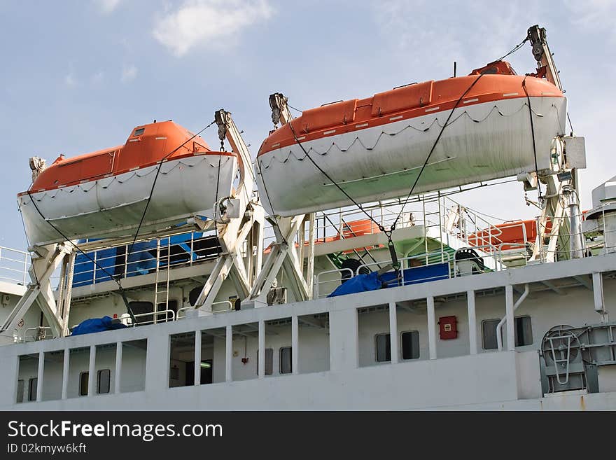 The two orange lifeboats on a ferry