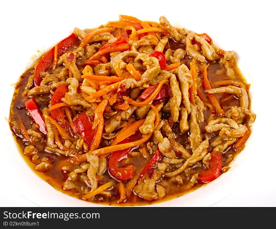 Chinese fried pork meat with pepper and carrot