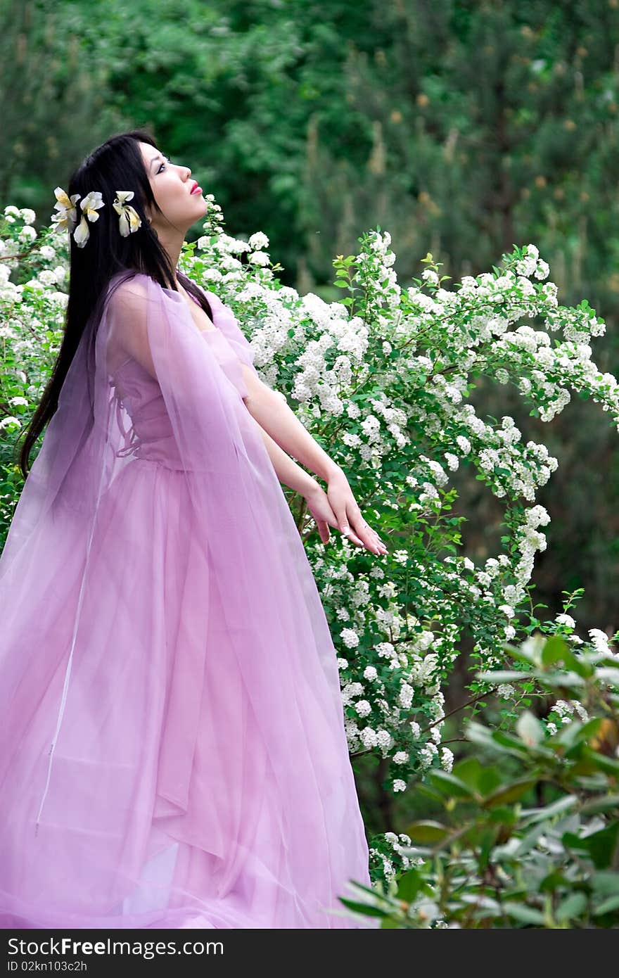 Beautiful asian woman in a pink dress. Beautiful asian woman in a pink dress