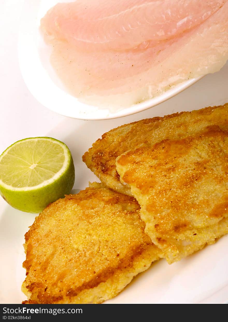 Fish Filet with lemon. Close up on white background