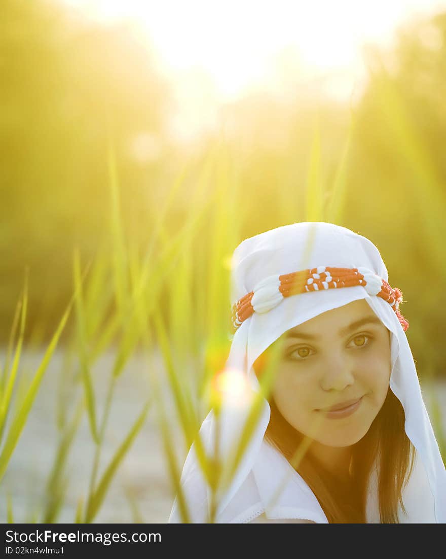 Portrait of beautiful woman in sunsat