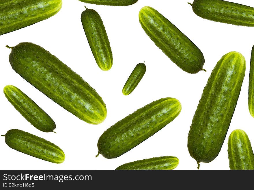 Ripe juicy cucumbers on a white background