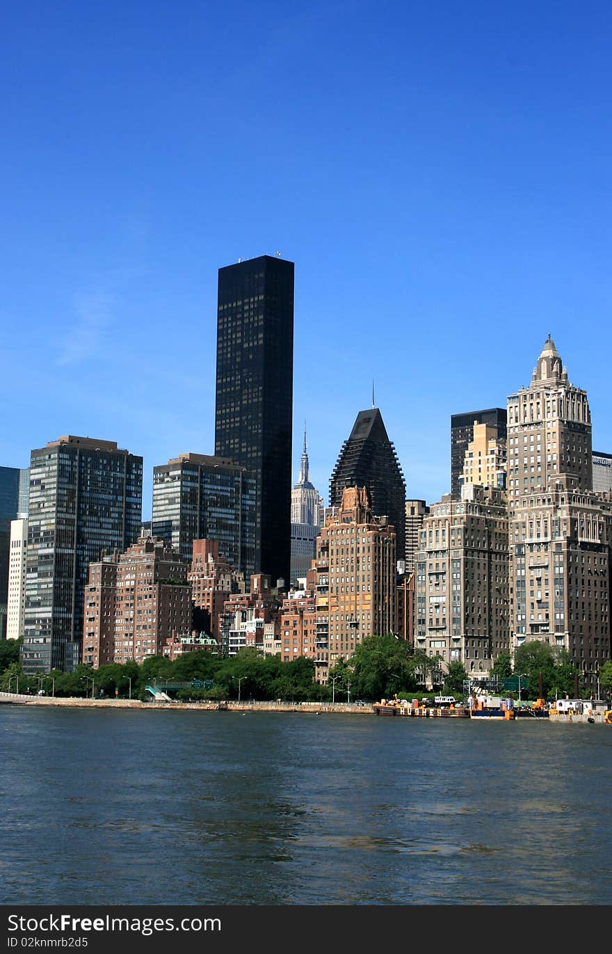 Midtown Manhattan skyline along the East River. Midtown Manhattan skyline along the East River.