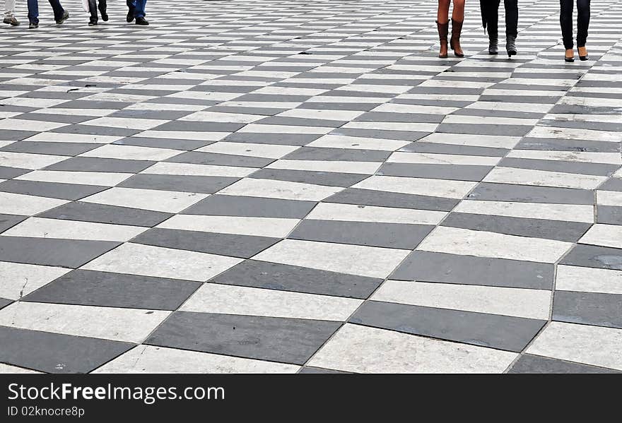 A group of people stroll on a square. Nice, France, Europe. A group of people stroll on a square. Nice, France, Europe