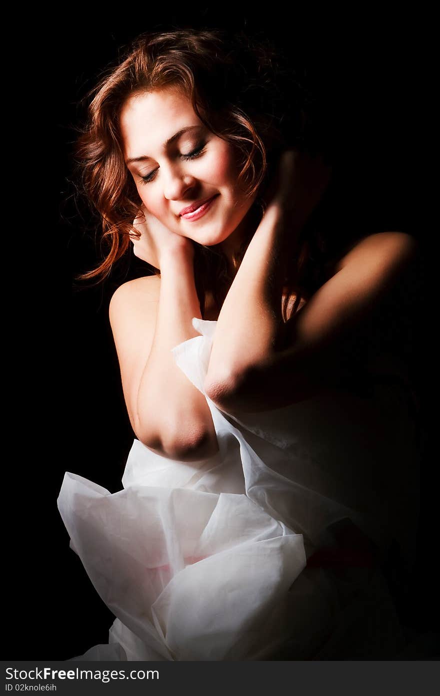 Portrait of a alluring young girl on black background. Portrait of a alluring young girl on black background.