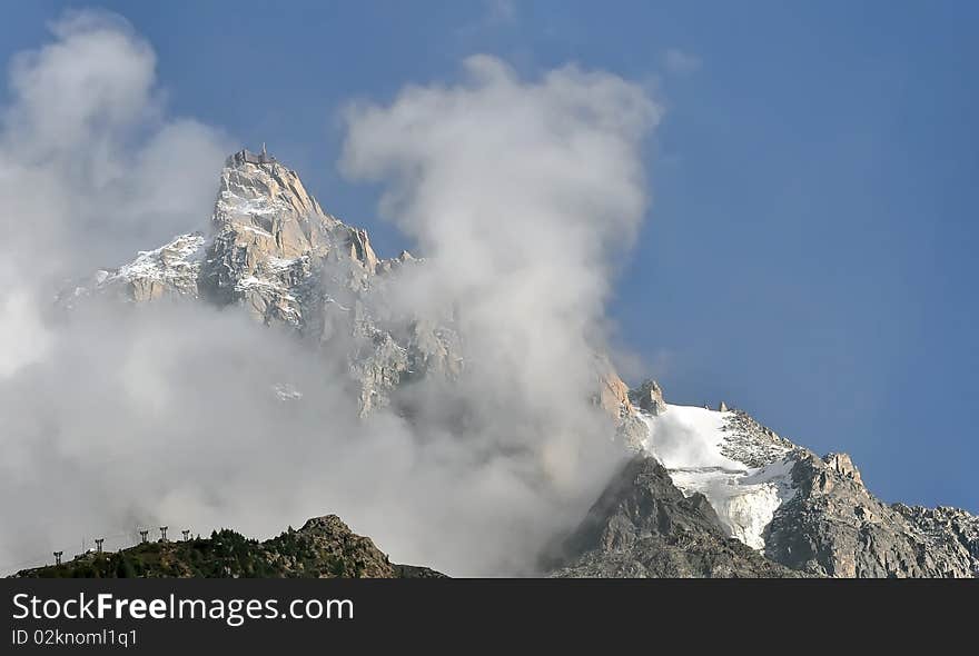 The Aiguille du Midi, a mountain in the Mont Blanc Massif in the French Alps. The cable car to the summit is world's highest cable car. Alps Mont Blanc, France, Europe