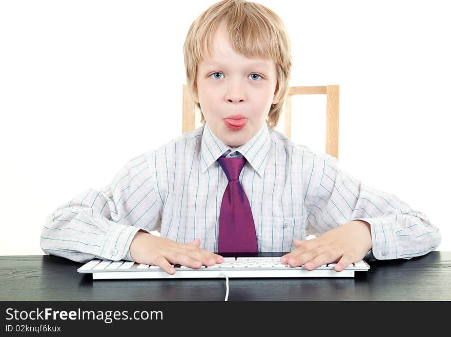 Boy with keyboard isolated on white