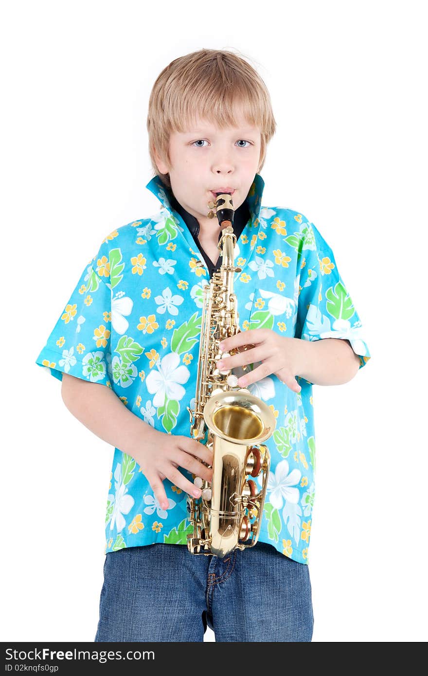 Boy plays on saxophone isolated on white