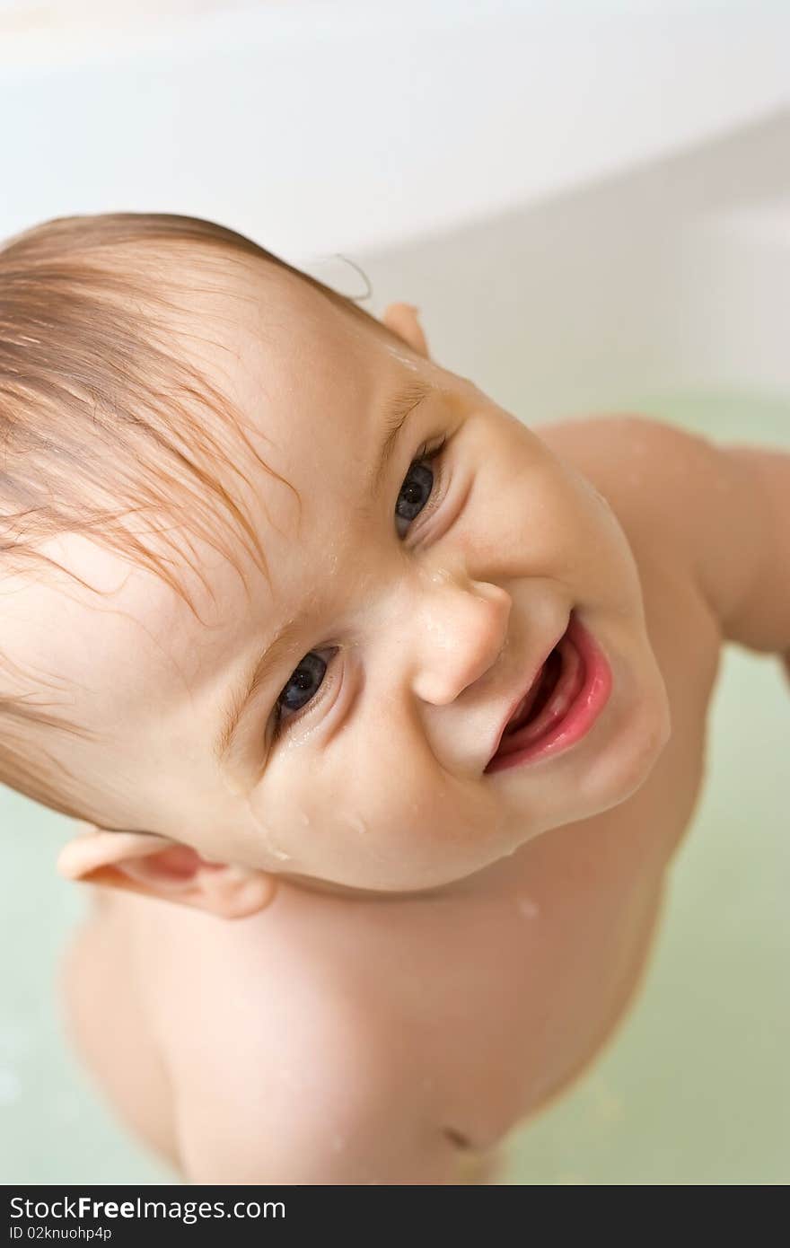 Wet baby in the bath