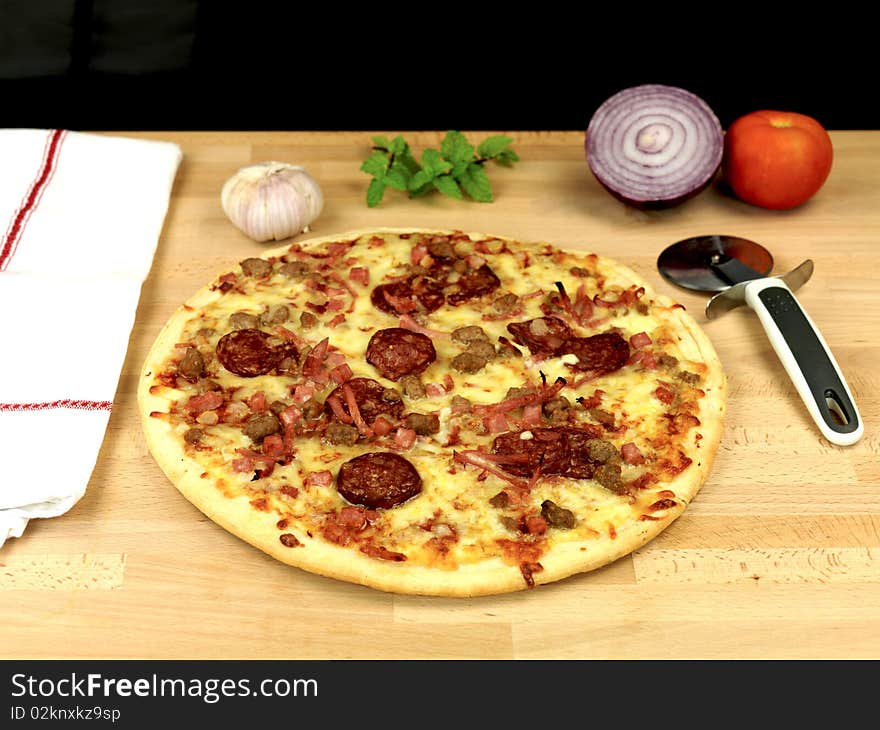 Freshly cooked takeaway pizza on a kitchen bench. Freshly cooked takeaway pizza on a kitchen bench