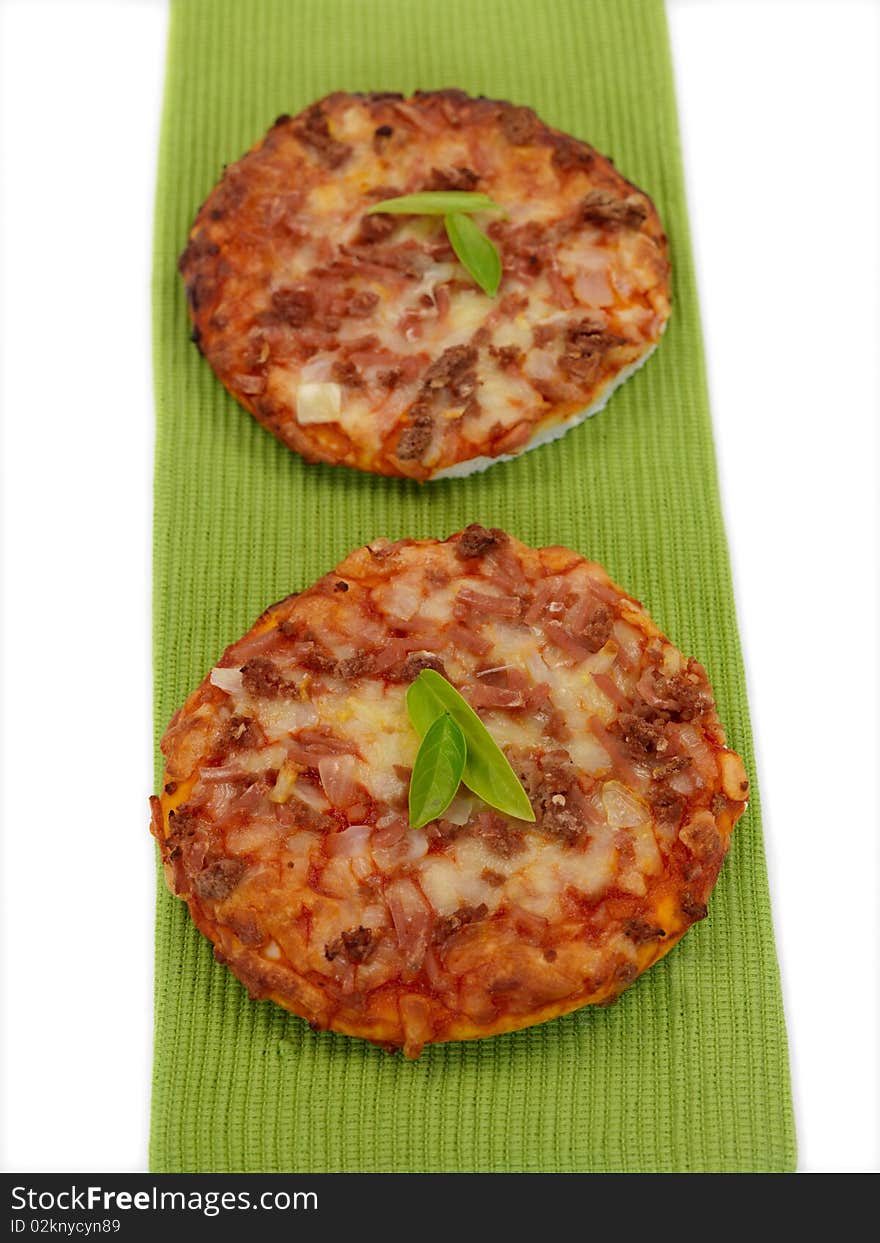 Mini Pizzas isolated on a kitchen bench