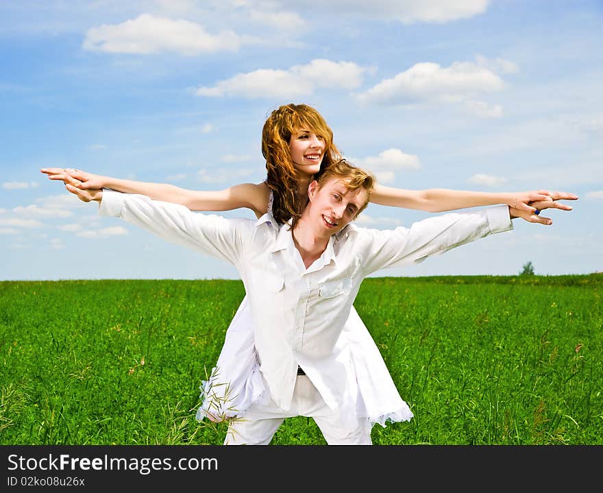 Couple holding hands in a flower field. Couple holding hands in a flower field