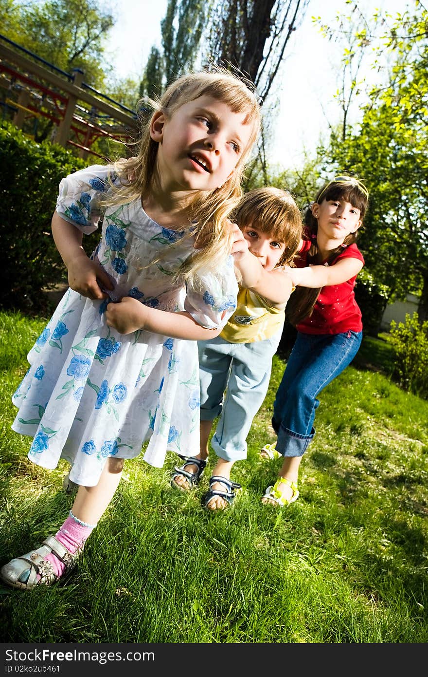 Two girls with boy in park