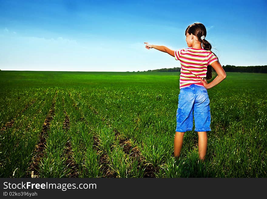 Small girl in green field. Small girl in green field