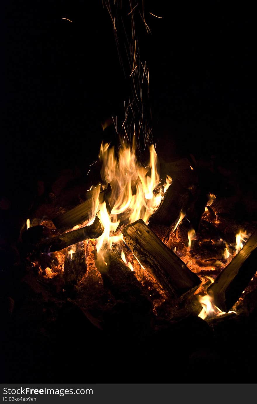 Camp fire burning in the night