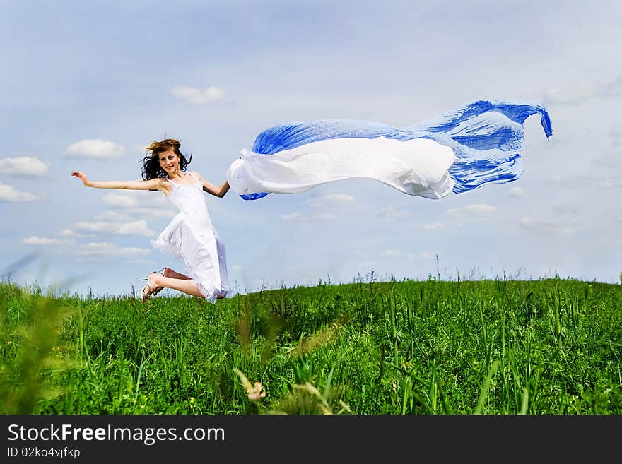 Happy young woman jumps