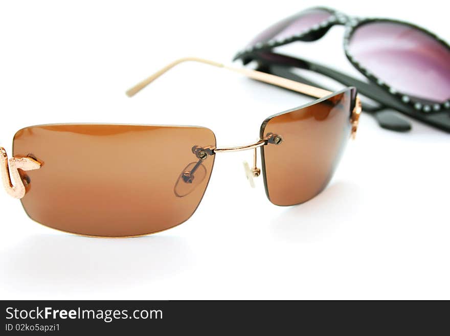 Two sunglasses isolated on white background.