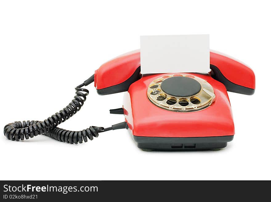 Red old telephone isolated on white