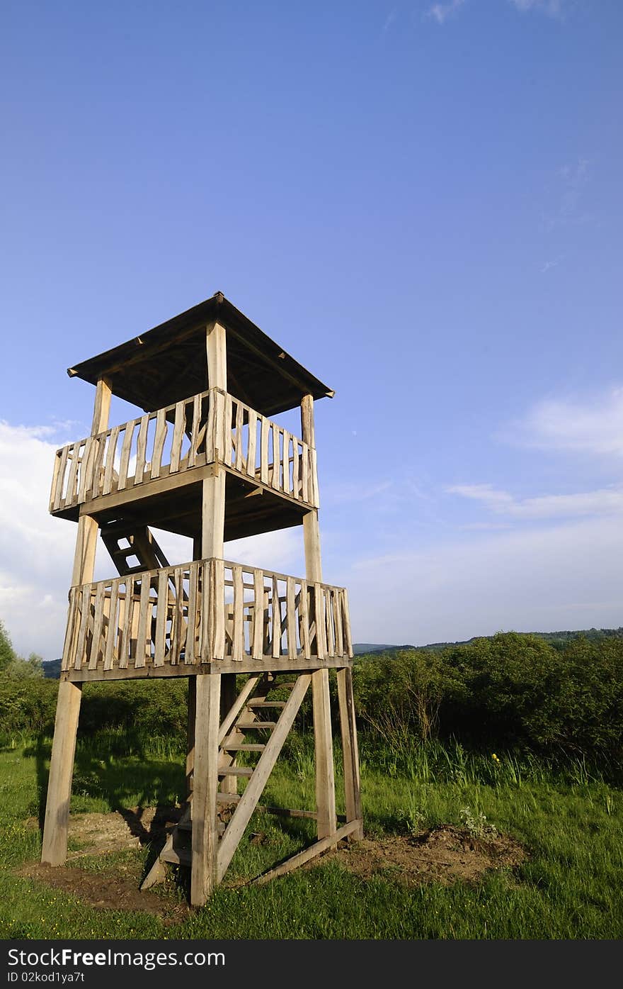 Wooden watchtower in the ornithological park