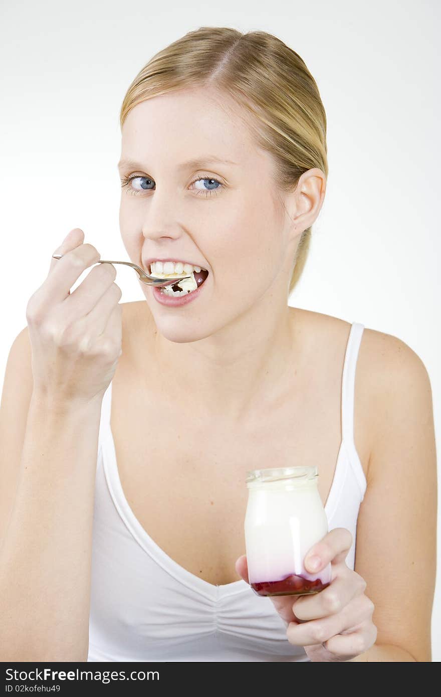 Portrait of woman eating yogurt. Portrait of woman eating yogurt