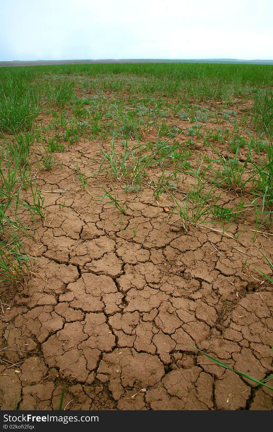 Droughty soil against the sky