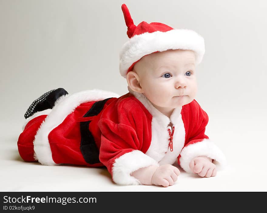 Little baby as Santa Claus