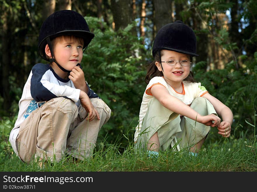 The boy and the girl play on a grass. The boy and the girl play on a grass