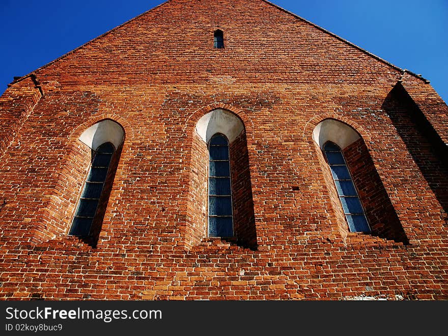 Gothic church tower against the blue sky