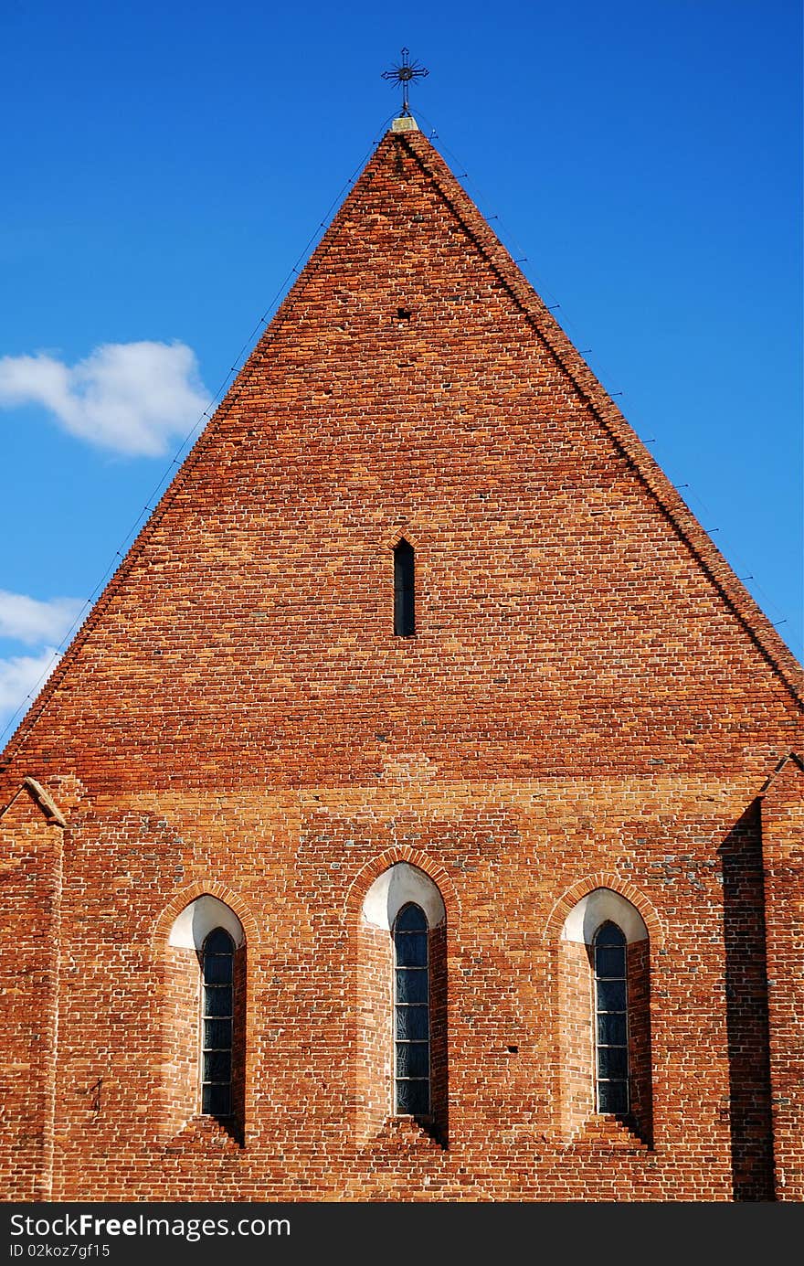 Gothic church tower against the blue sky