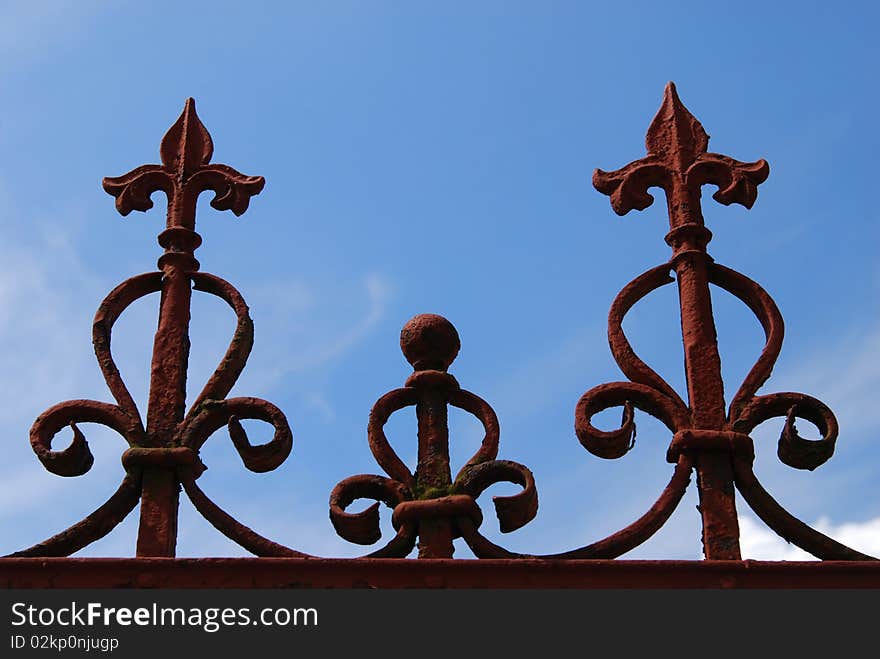 Old gate detail on the blue sky