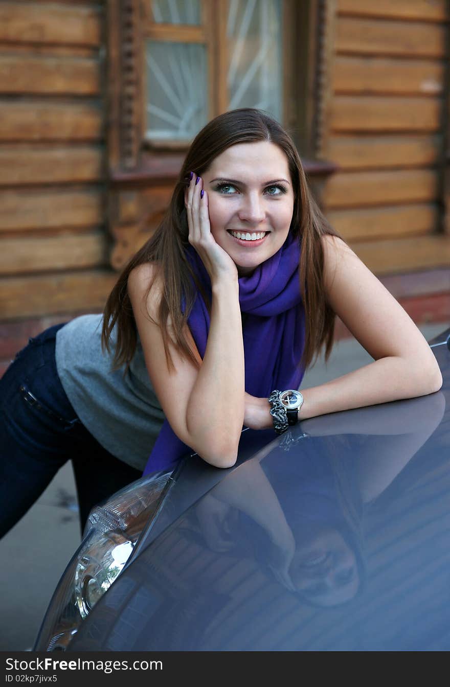 The beautiful girl near the car