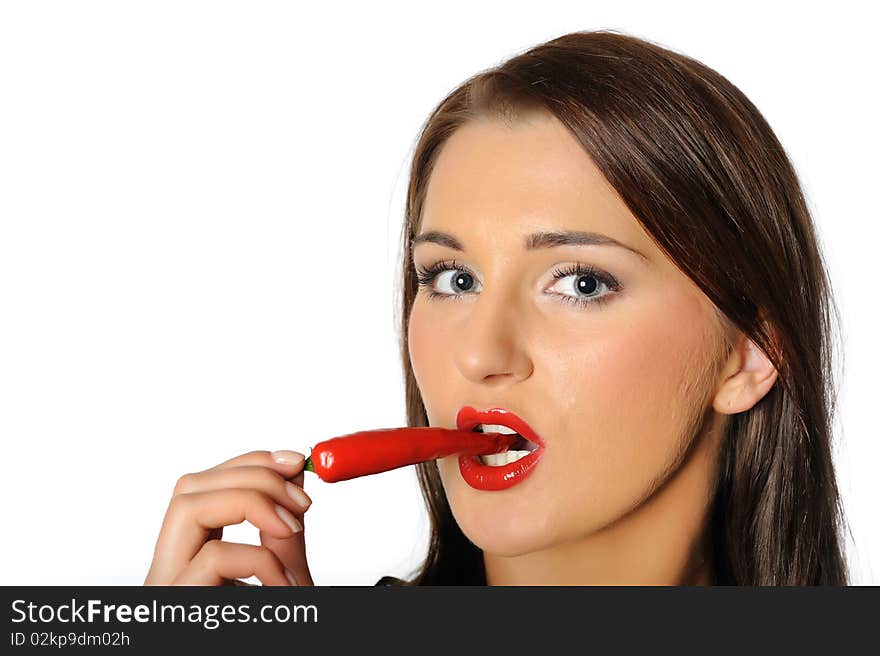 Beautiful sexy woman with red hot chilli pepper. isolated on white background