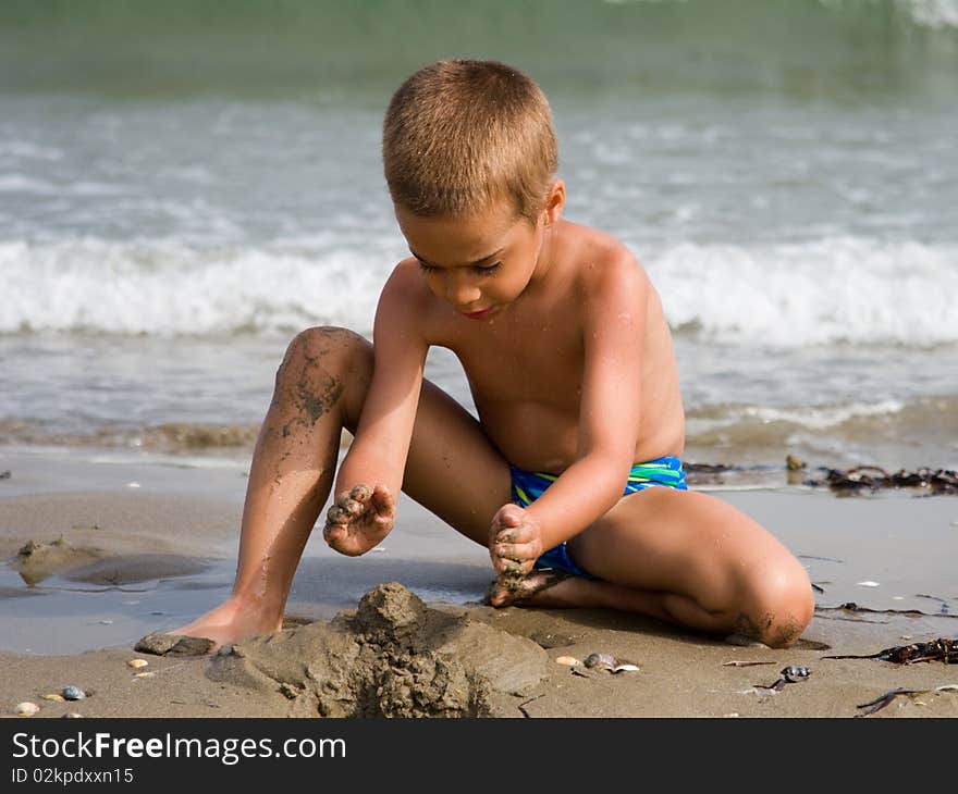 Little child playing on the beach. Little child playing on the beach