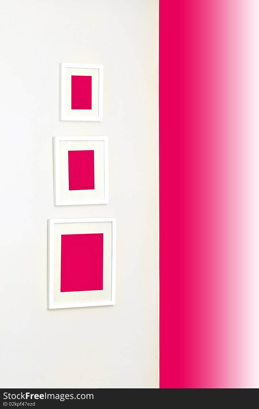 Corner of a room with frames on a wall. Corner of a room with frames on a wall