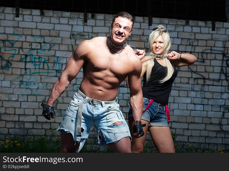 Muscular young man with his girlfriend. Muscular young man with his girlfriend